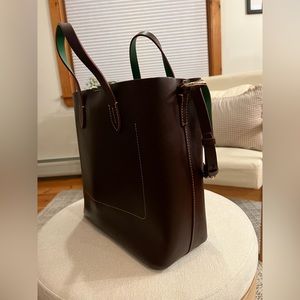 Brand new, Dooney @ Bourke tote bag. Dark brown leather with a green inside.